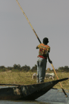 Young Kid Pushing Boat